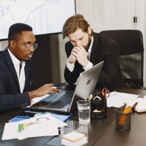 Team reviewing budget overrun charts in a strategy meeting