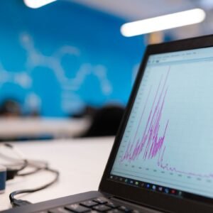 Analytics graph on laptop screen representing Google Ads attribution