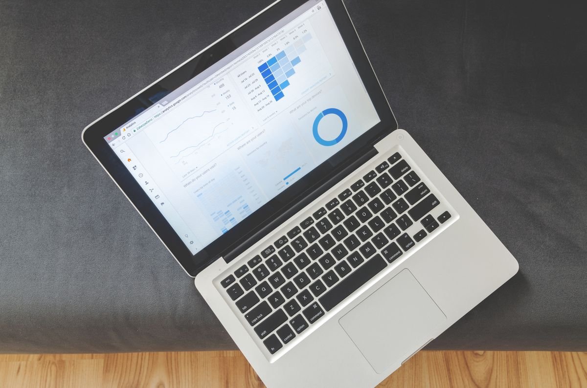 Laptop displaying an analytics dashboard with charts and graphs, illustrating Copilot governance framing in a Dynamics 365 deployment - Notoriti